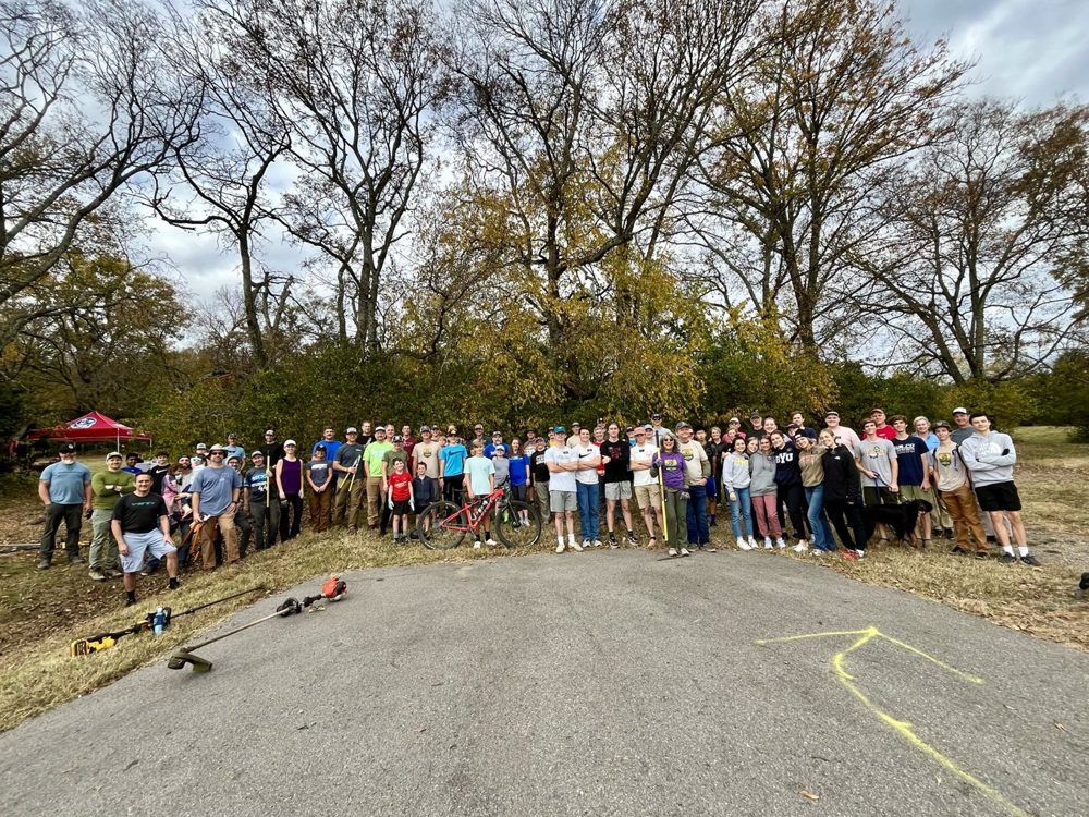 Volunteers lined up at a Smith Park trail workday